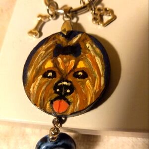 Handmade and handpainted yorkshire terrier 🗝 keychain on a navy wooden disc.